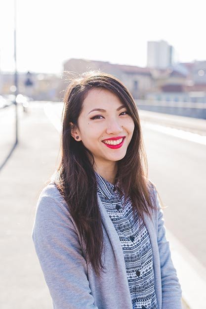 woman smiling after trauma therapy